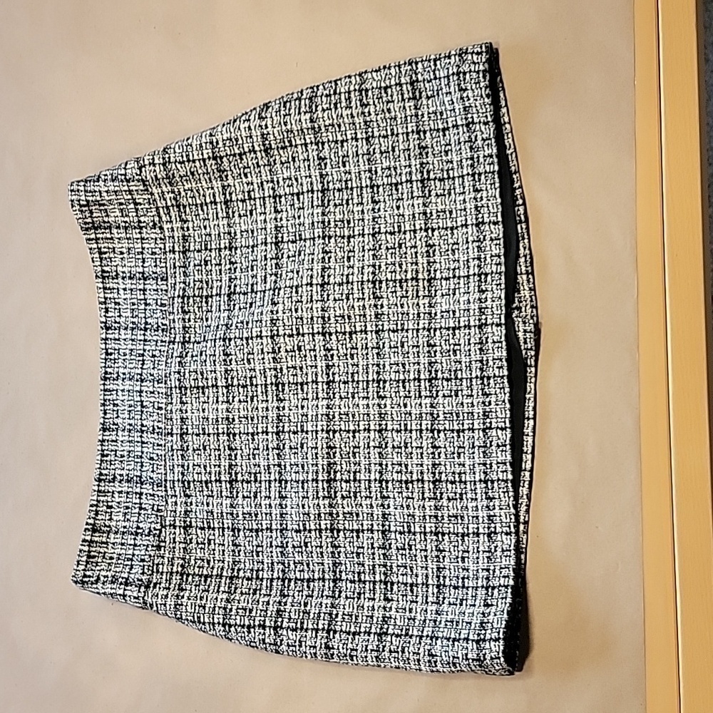 The Limited Size 4 Black White Tweed Mini Skirt, Lined, Gently Used Condition.